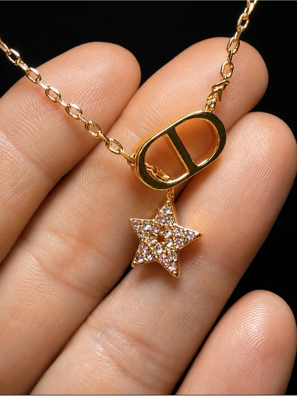 Gold Star Pendant Necklace with Pink Crystal Accents